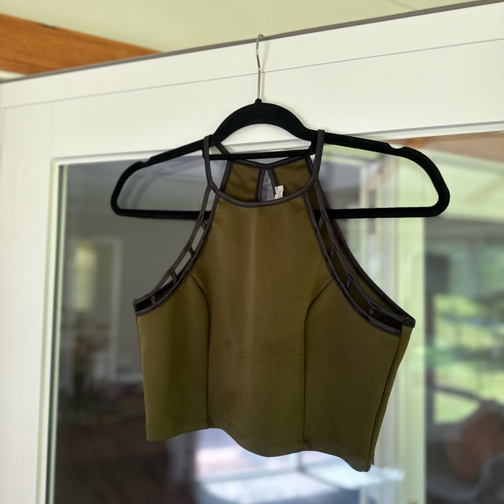 Olive green crop top with faux leather detail.